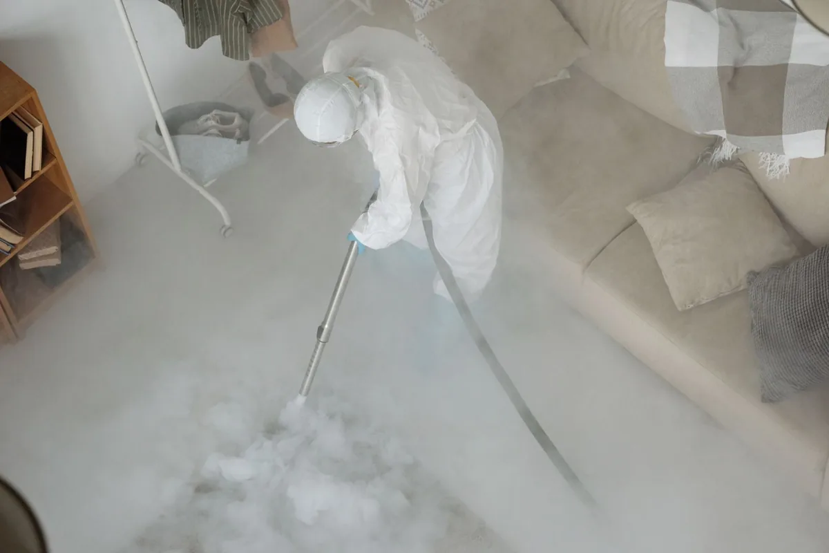 Biohazard cleanup technician in protective equipment, Halifax, VA